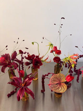 Bud vases with burgundy flowers