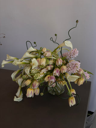 Bouquet of flowers on a dark surface with a light gray background
