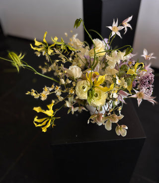 Bouquet of flowers on a dark surface with a neutral background