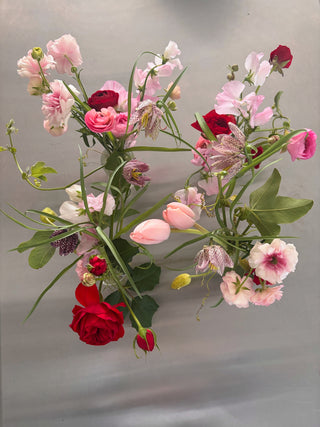 nud vases with pink and red flowers by wildstems