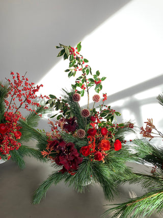 holiday flower arrangement in green and red flowers by wildstems los angeles
