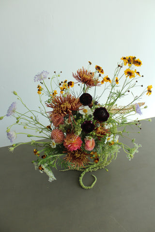 Bouquet of fall wildflowers with a neutral background
