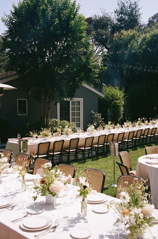 wedding flowers and bud vases in a garden