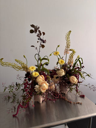 Same day flower delivery los angeles
Two unique artful floral arrangements on a stainless steel table