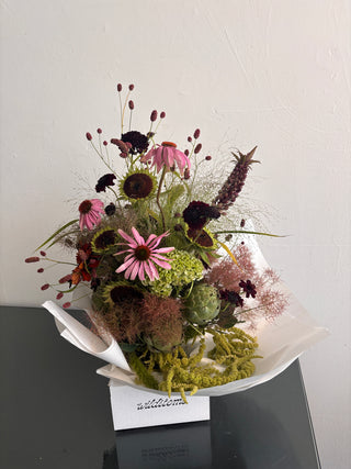 Smoke bush, echinacea, green textures in an artful floral design by wildstems los angeles. Same day delivery