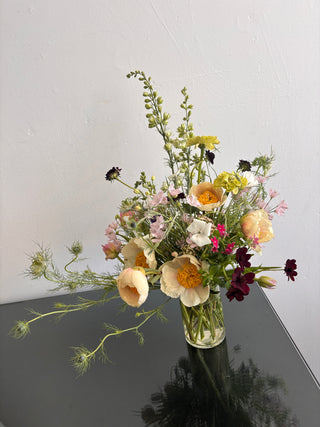 Bouquet of flowers on a car window with a blurred background