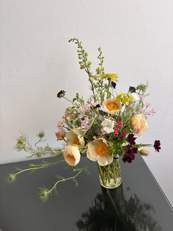 Bouquet of flowers on a car window with a blurred background