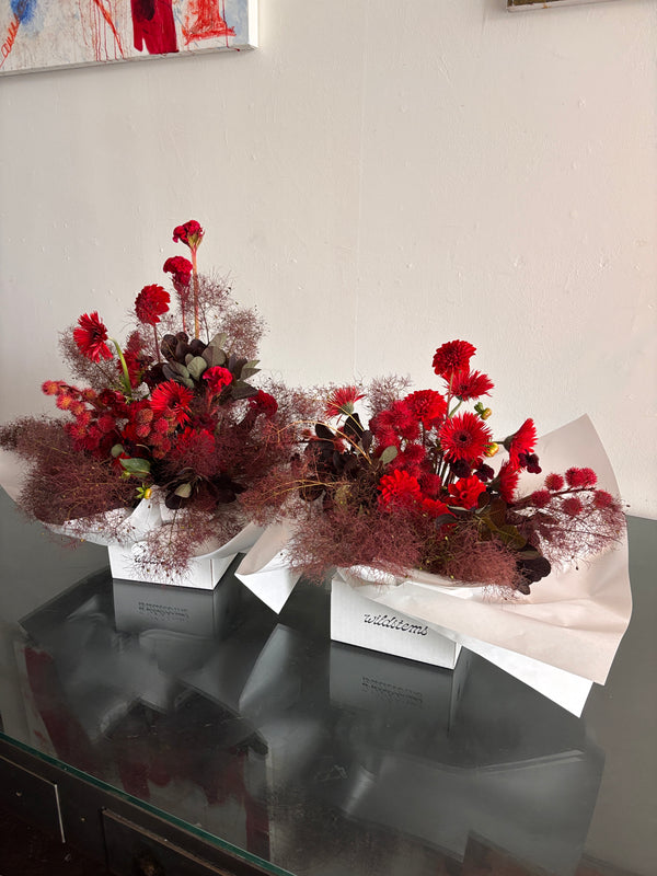 Red flowers and burgundy smoke bush for delivery in los angeles
