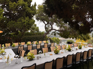 modern tablescape with silver linens and green centerpiece flowers