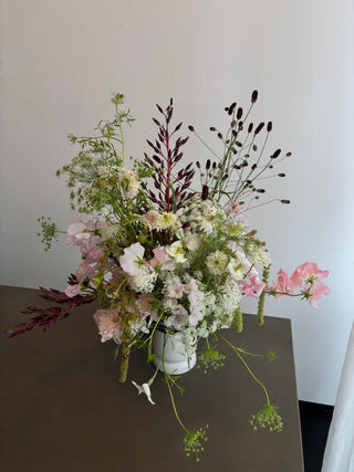 white wildflowers arrangement on a gray table