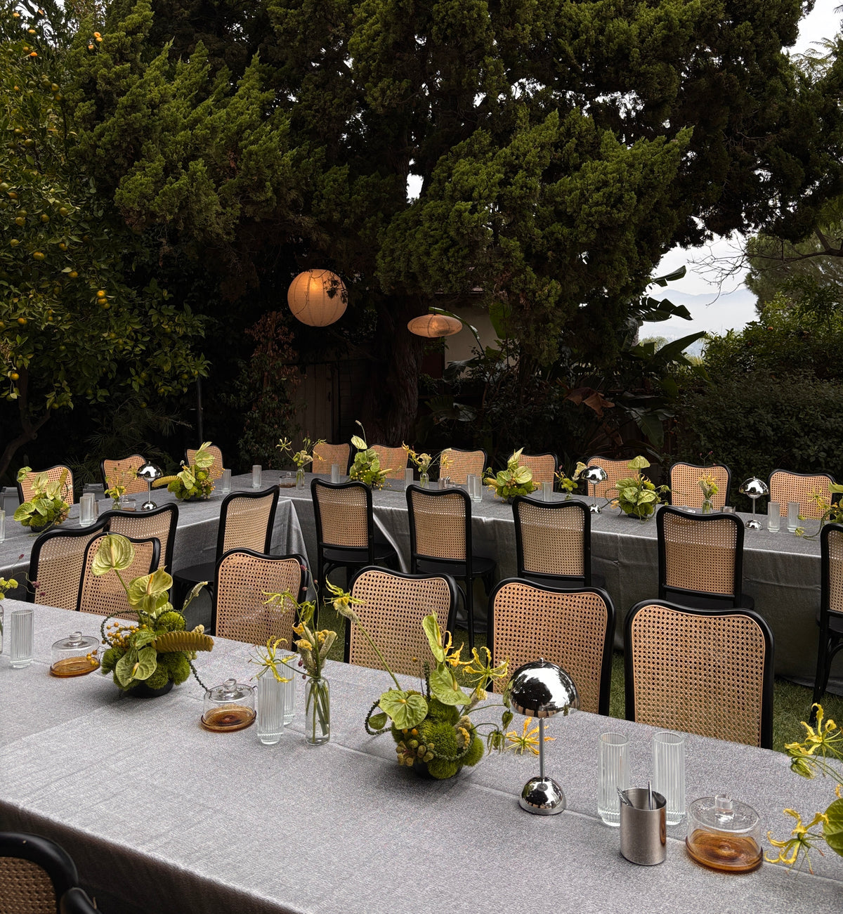 luxury event florals in Los Angeles green sculptural florals and chrome elements on a table scape for Etsy design awards Los Angeles